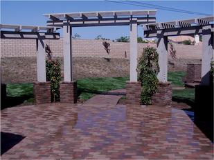 Paver brick patio with pergolas